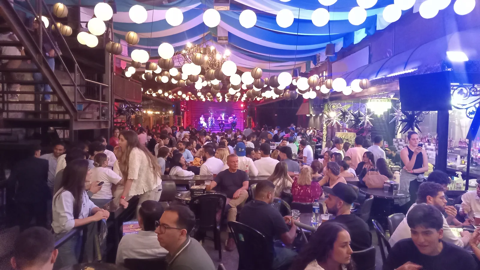 Crowd enjoying a lively event at Red Macaw Bar and Brewery