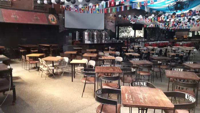 Red Macaw interior with tables and a view of its bar